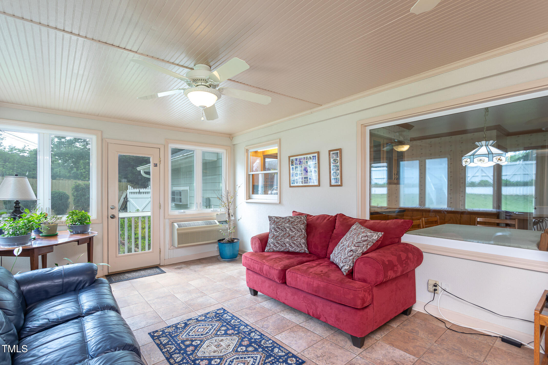 1213 Indian Trail Drive Raleigh, NC 27609 - Photo 30 of 50 a living room with furniture and a large window