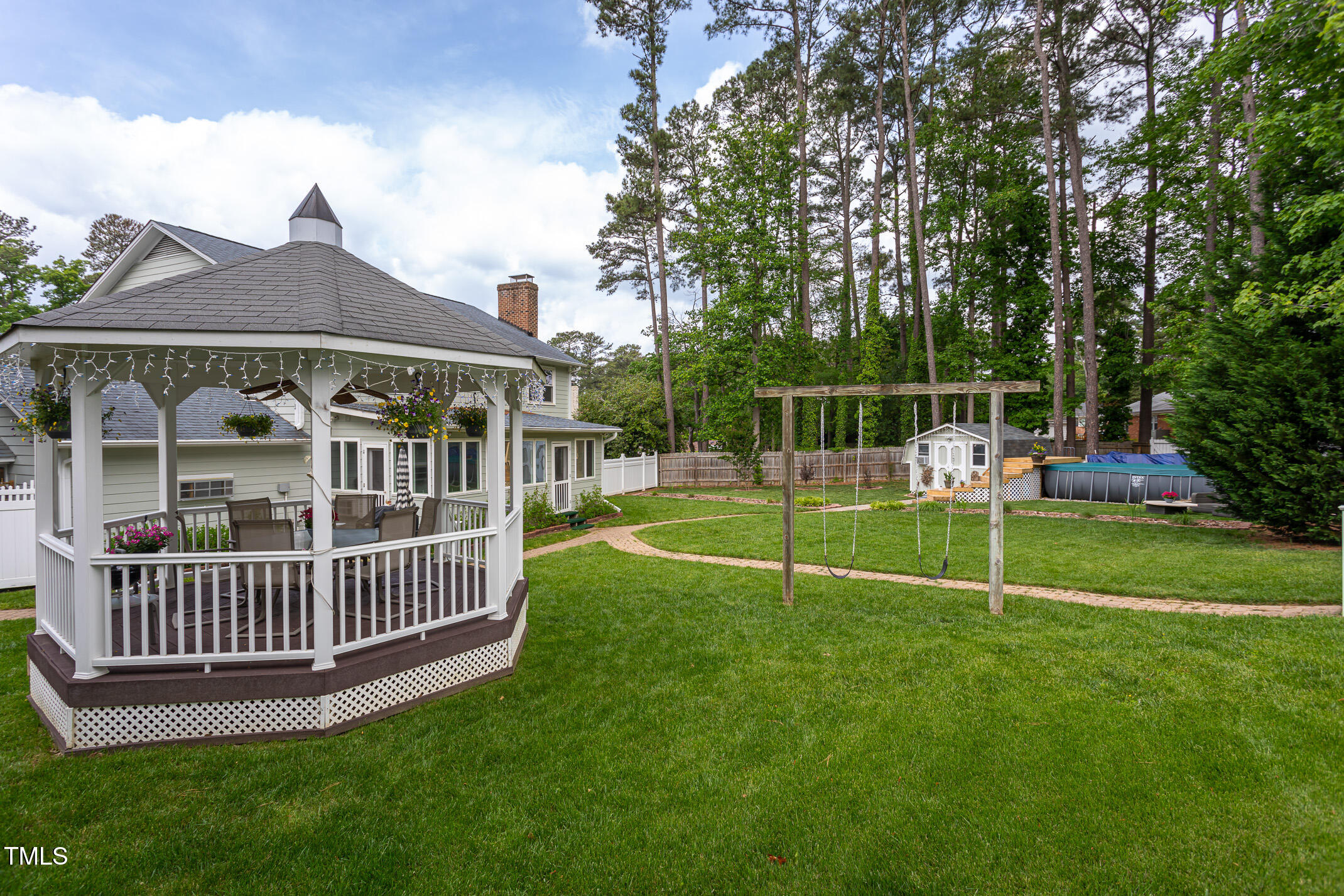 1213 Indian Trail Drive Raleigh, NC 27609 - Photo 33 of 50 a view of a house with a yard and deck