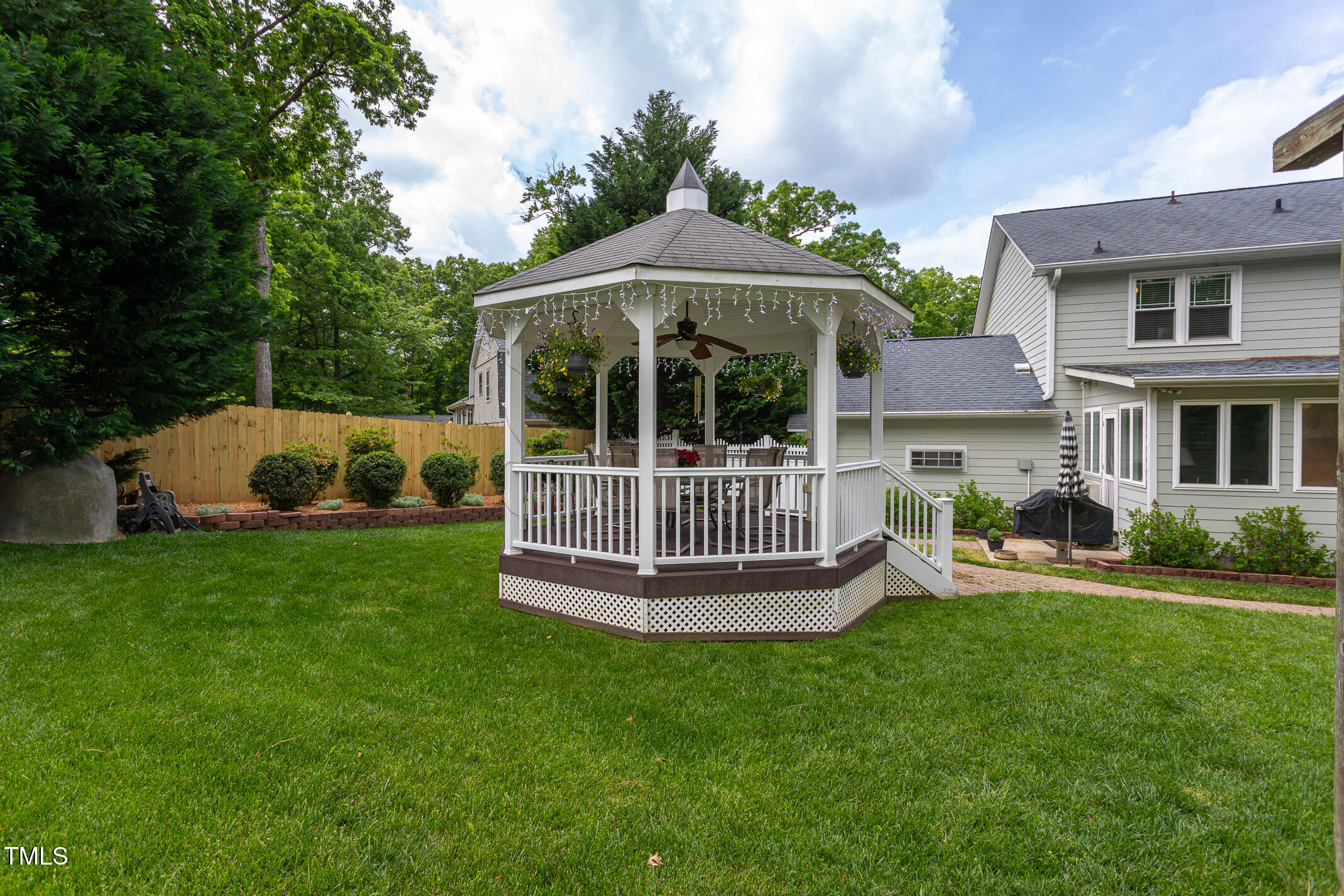 1213 Indian Trail Drive Raleigh, NC 27609 - Photo 34 of 50 a view of a house with a yard and deck
