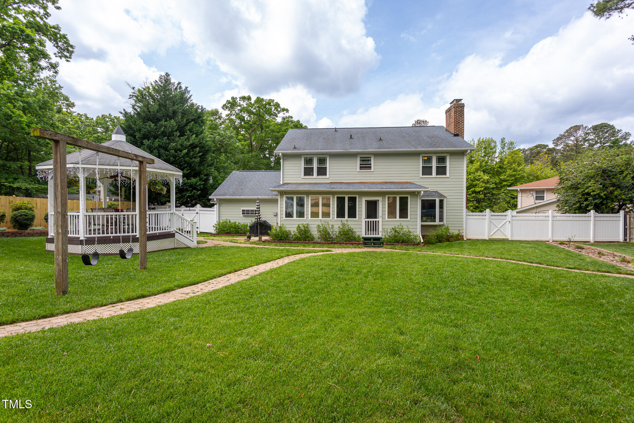 1213 Indian Trail Drive Raleigh, NC 27609 - Photo 35 of 50 a view of a house with a backyard