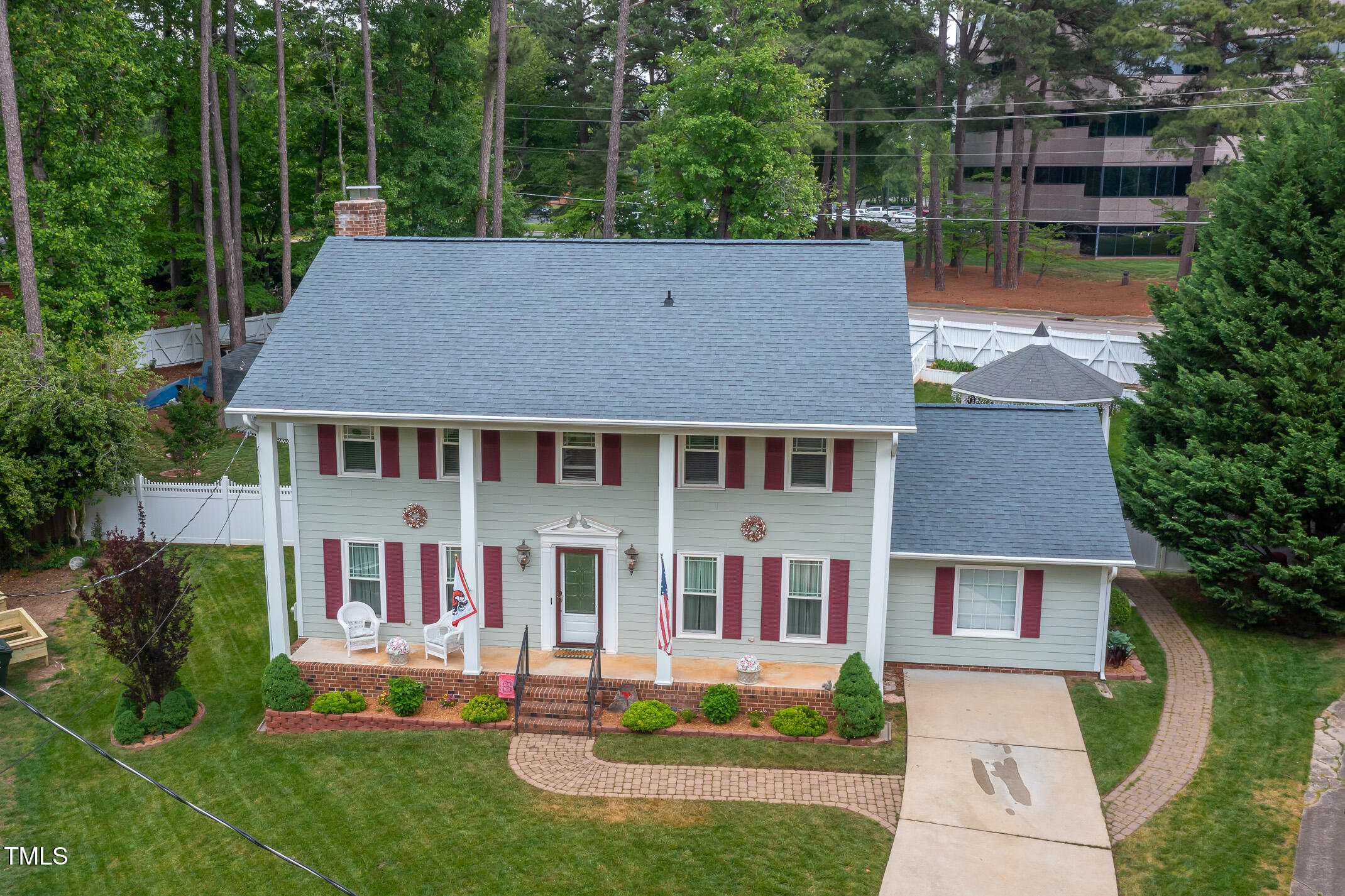 1213 Indian Trail Drive Raleigh, NC 27609 - Photo 44 of 50 front view of house with a yard and potted plants
