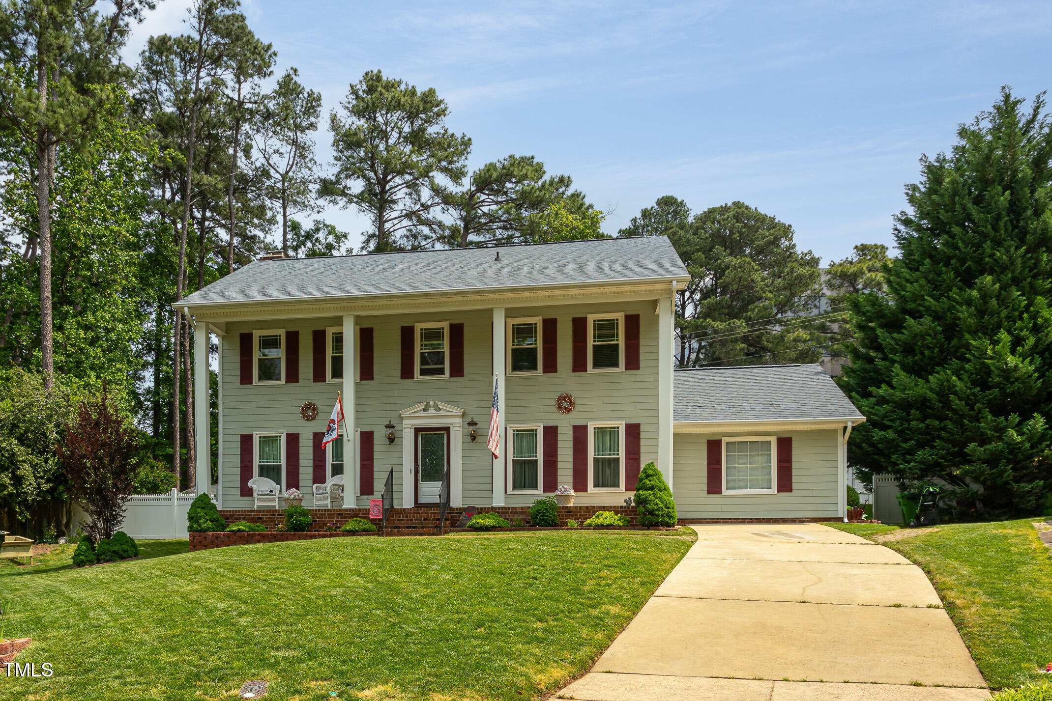 1213 Indian Trail Drive Raleigh, NC 27609 - Photo 50 of 50 a front view of a house with a garden