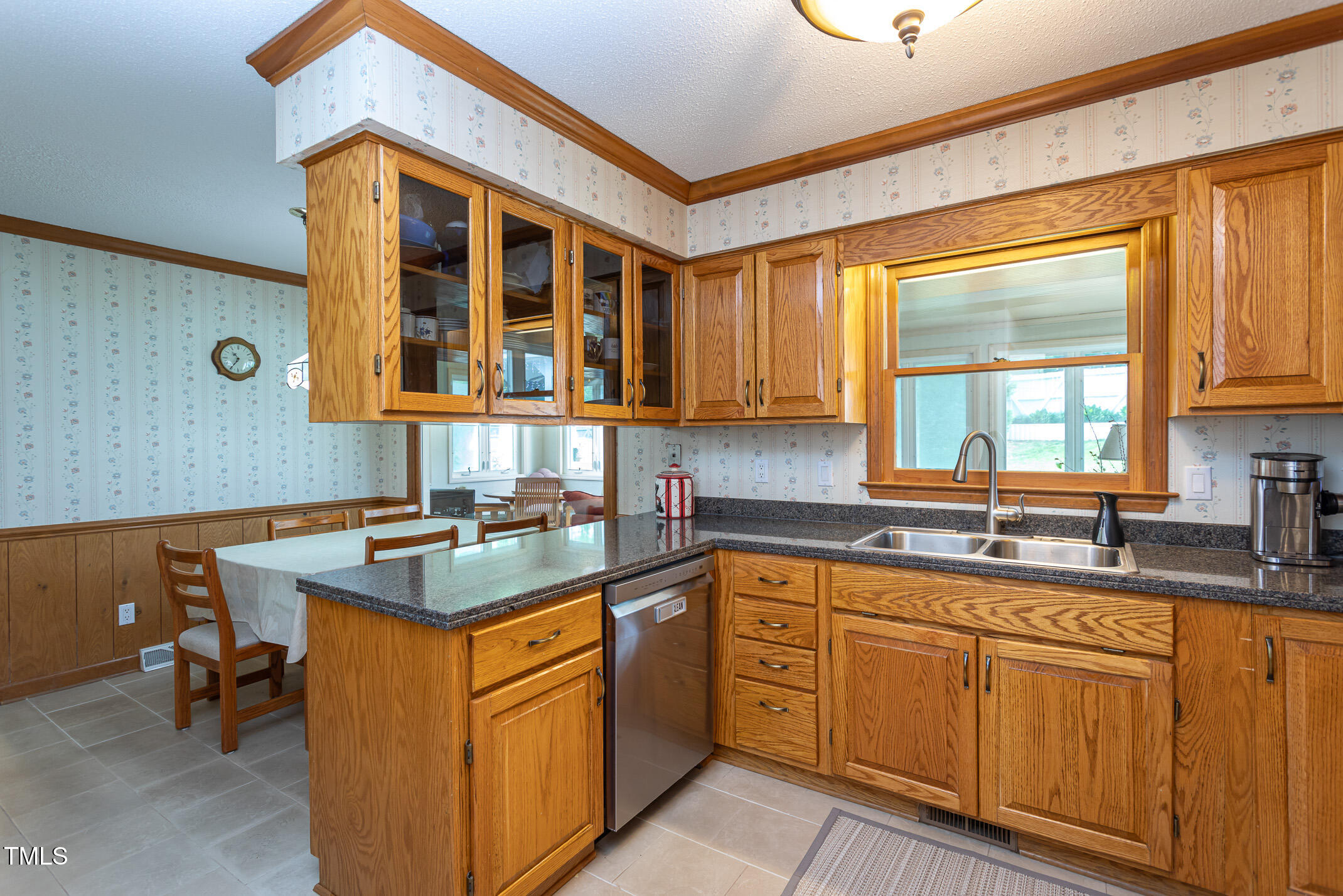1213 Indian Trail Drive Raleigh, NC 27609 - Photo 8 of 50 a kitchen with stainless steel appliances granite countertop a sink and cabinets