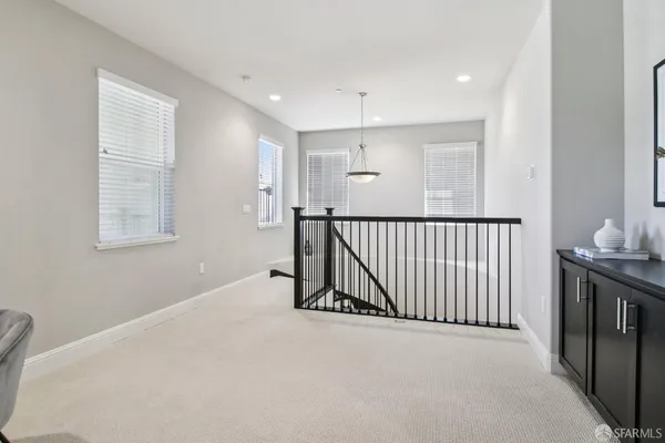a bedroom with a bed and a potted plant