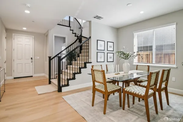 a view of a dining room with furniture and a window