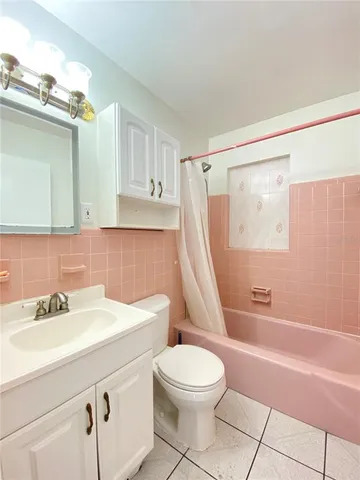 a bathroom with a sink a toilet and a bathtub