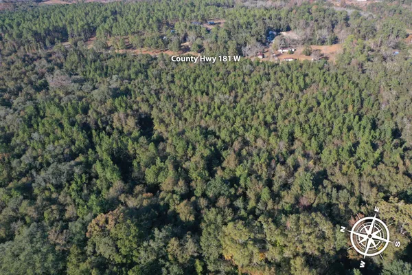 an aerial view of a city and mountain view in back