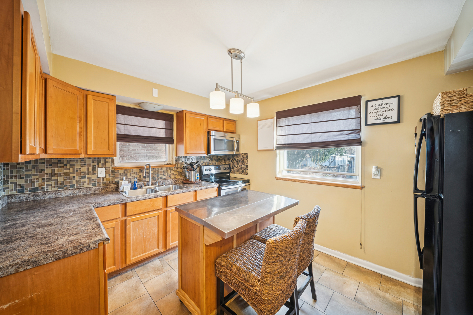 8435 South State Street Chicago, IL 60619 - Photo 4 of 16 a kitchen with a sink stove and refrigerator