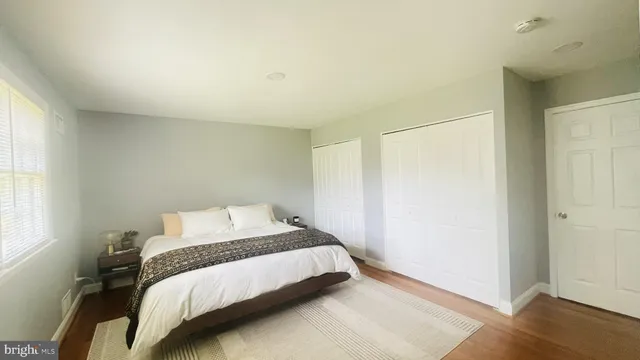 a bed room with a bed and a window