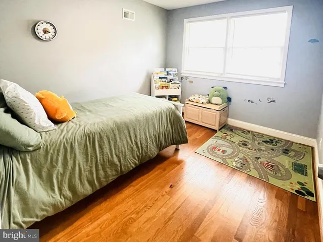 a bedroom with bed and window