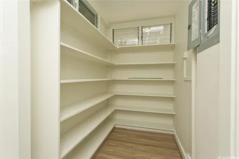 a view of walk in closet with empty racks