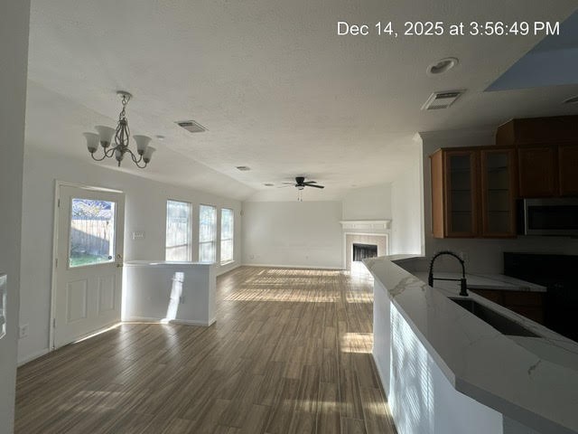 12211 Bringate Court Houston, TX 77066 - Photo 18 of 22 a view of a kitchen with a sink wooden cabinets and stainless steel appliances