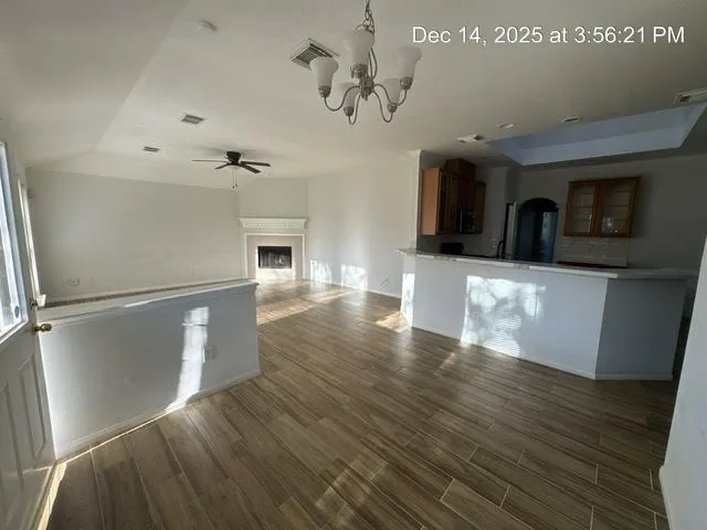 a view of a livingroom with wooden floor
