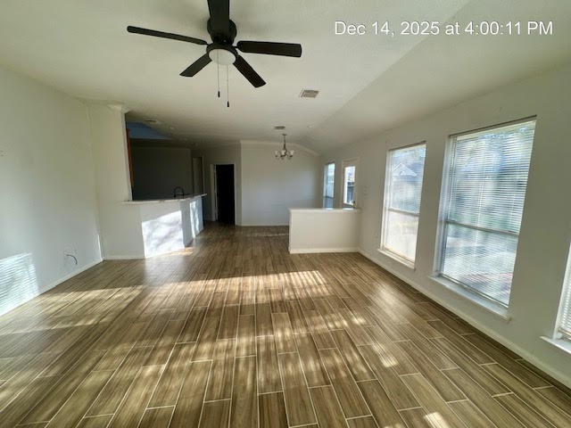12211 Bringate Court Houston, TX 77066 - Photo 6 of 22 a view of a living room with wooden floor and windows