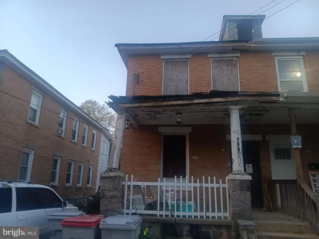 a front view of a house with yard