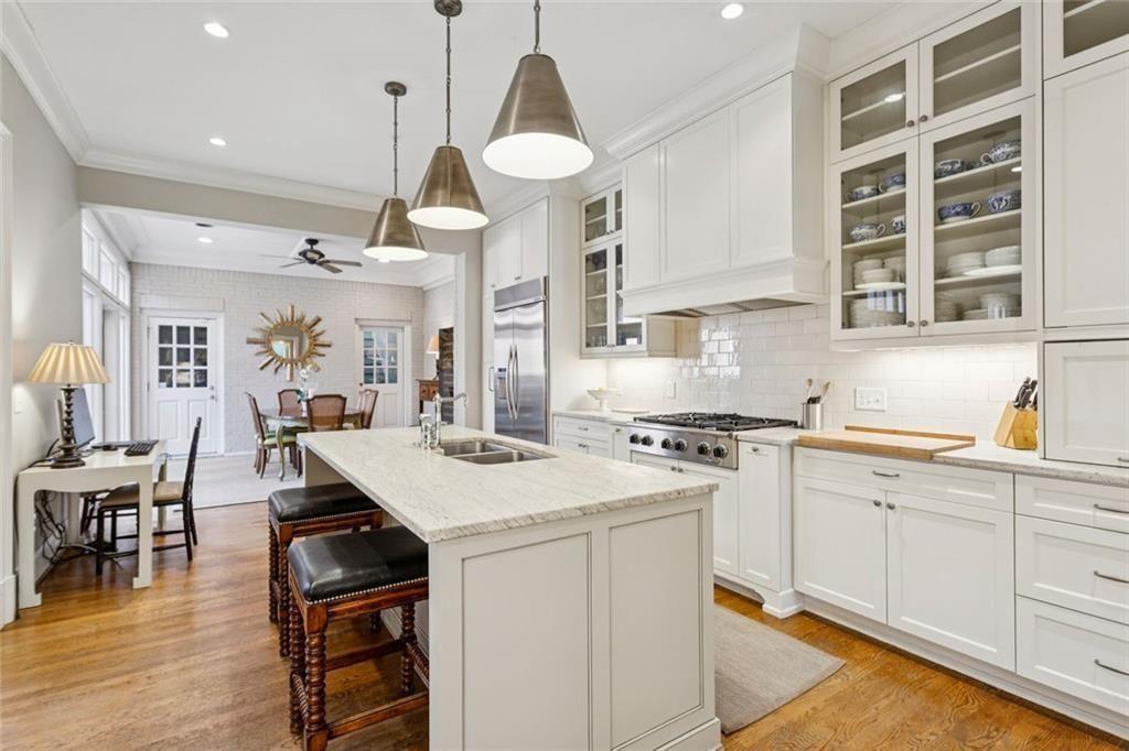 3005 Ranch Road Southeast Atlanta, GA 30339 - Photo 21 of 57 a kitchen with a stove a table and chairs