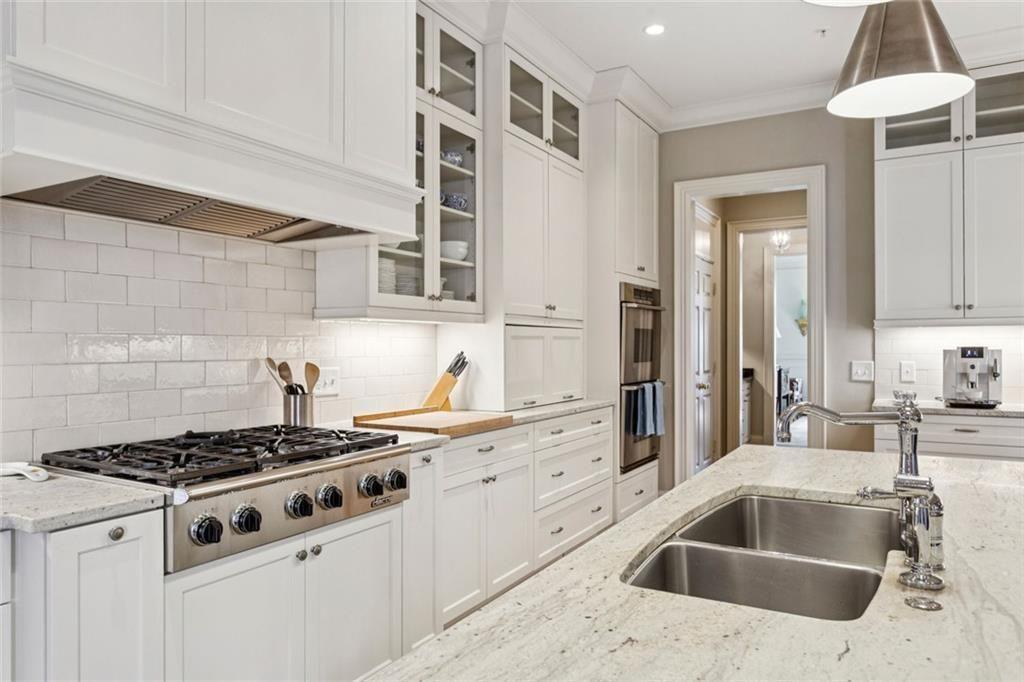 3005 Ranch Road Southeast Atlanta, GA 30339 - Photo 23 of 57 a kitchen with granite countertop a stove and a sink