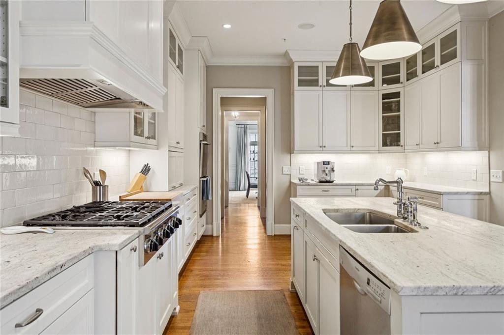 3005 Ranch Road Southeast Atlanta, GA 30339 - Photo 26 of 57 a kitchen with stainless steel appliances granite countertop a sink stove and cabinets
