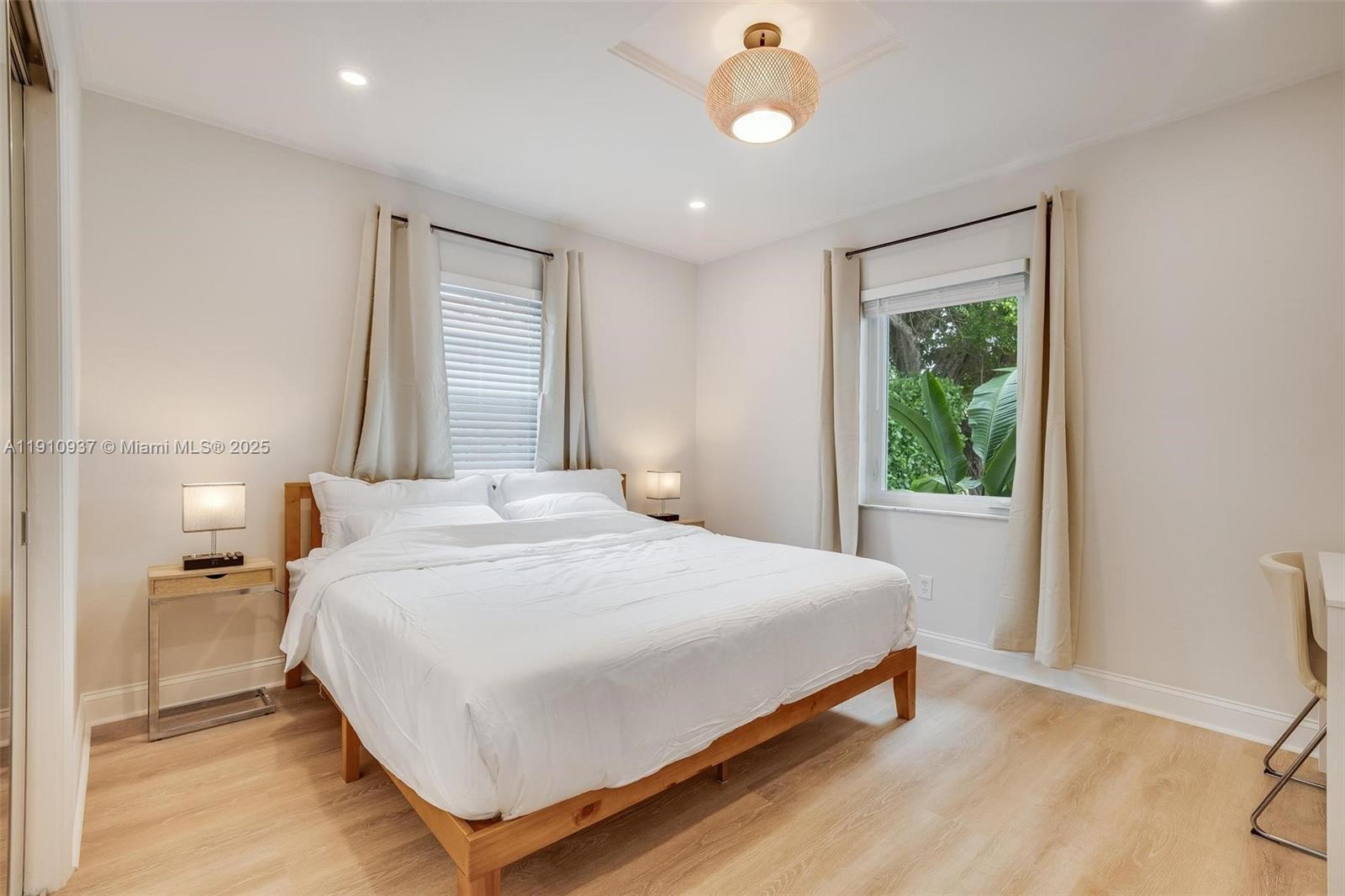 2969 Southwest 20th Street Miami, FL 33145 - Photo 15 of 28 a bedroom with a bed and window