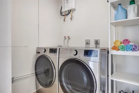 a view of livingroom with washer and dryer