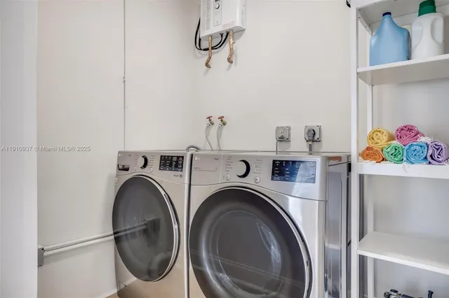a view of livingroom with washer and dryer