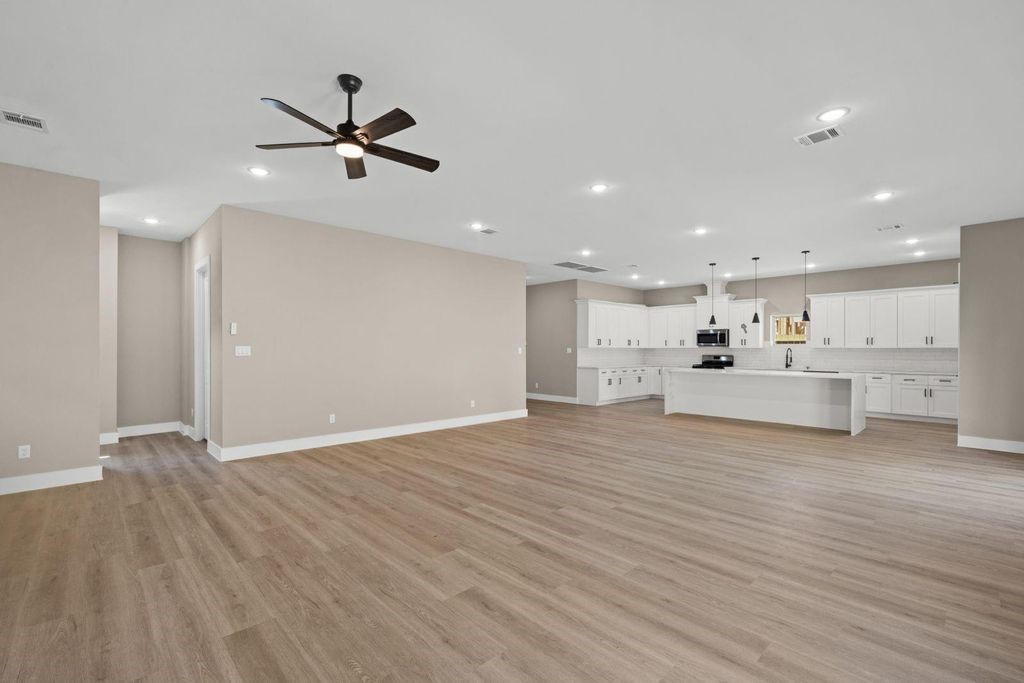 2615 Piemonte Avenue Cir Spring Spring, TX 77388 - Photo 4 of 21 a view of a kitchen with a dishwasher wooden floor and a refrigerator