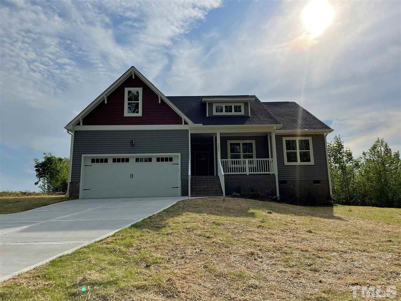 1820 Bryantown Road Spring Hope, NC 27882 - Photo 1 of 23 a front view of a house with a garden