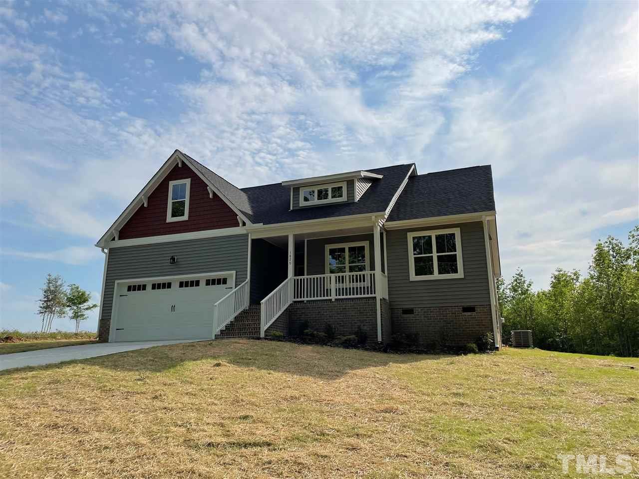 1820 Bryantown Road Spring Hope, NC 27882 - Photo 2 of 23 a front view of a house with a yard