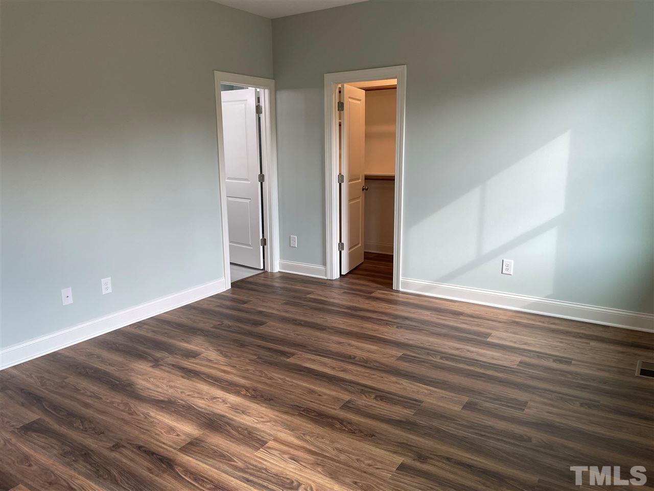 1820 Bryantown Road Spring Hope, NC 27882 - Photo 13 of 23 a view of empty room with wooden floor
