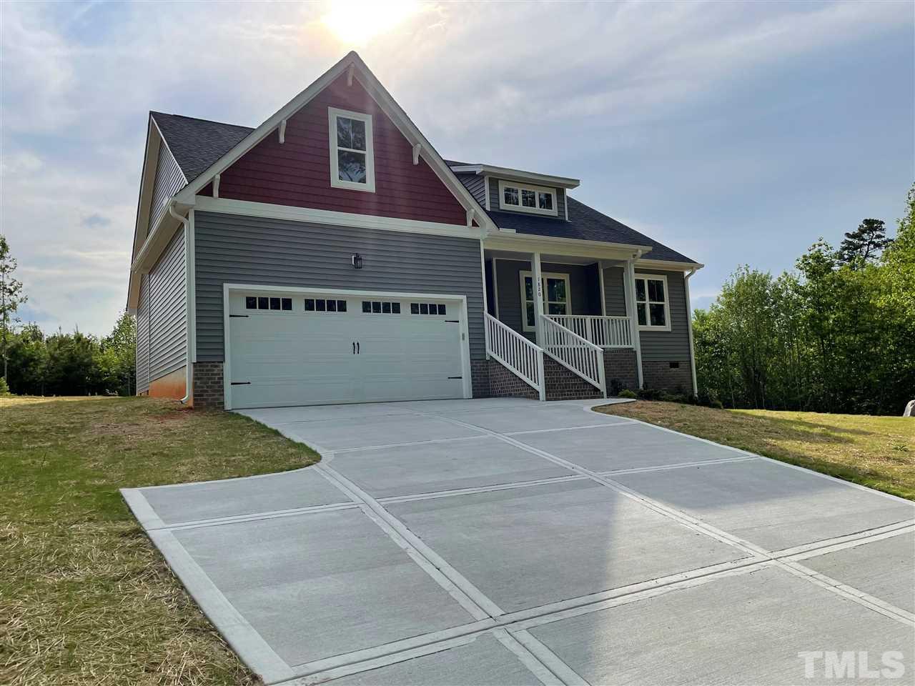 1820 Bryantown Road Spring Hope, NC 27882 - Photo 3 of 23 a front view of a house with a yard and garage