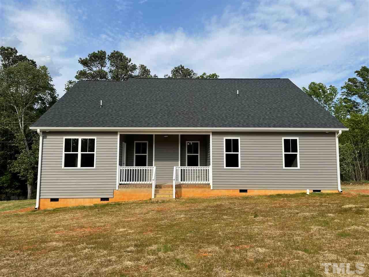 1820 Bryantown Road Spring Hope, NC 27882 - Photo 22 of 23 a front view of a house with a yard
