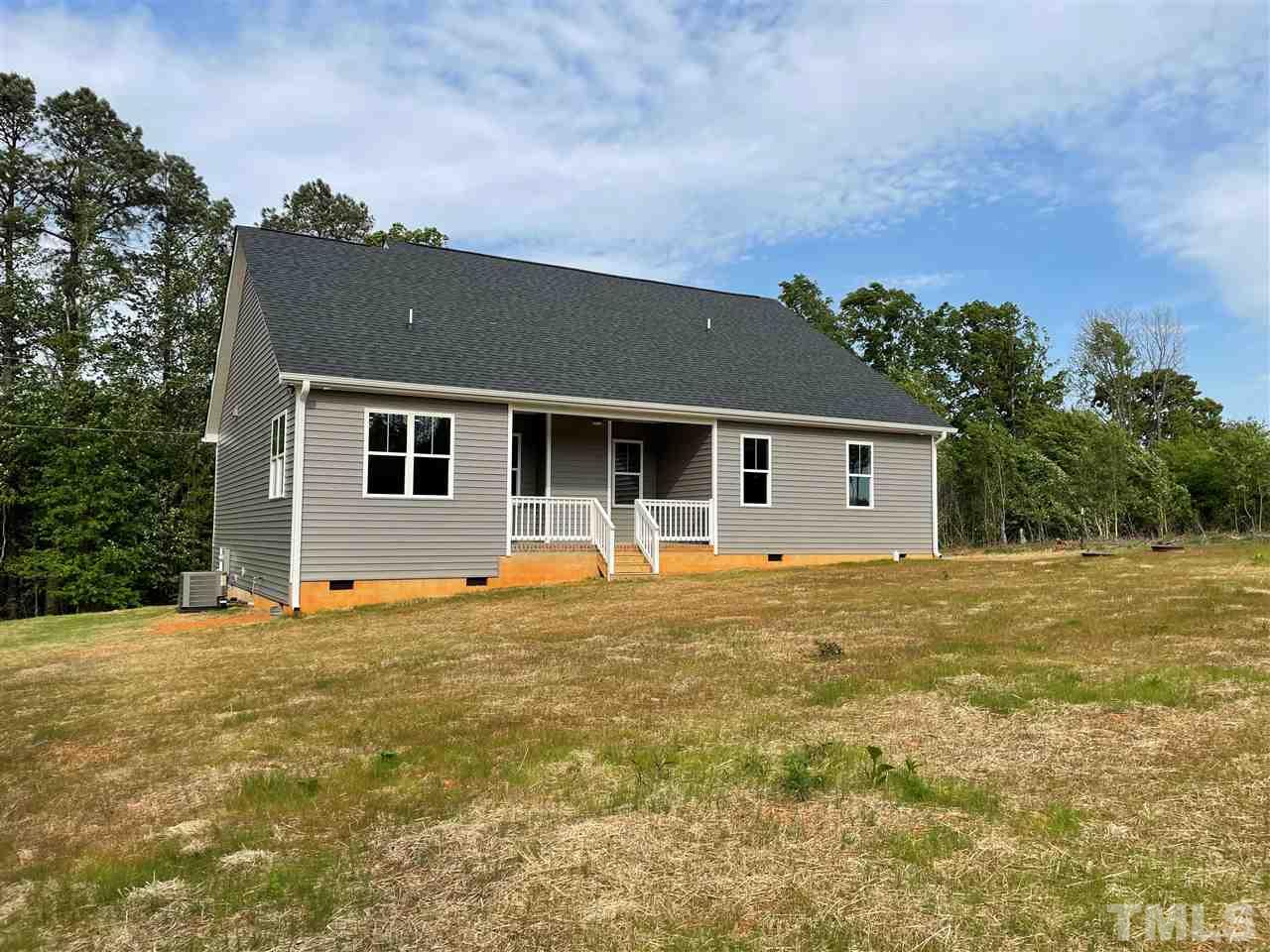 1820 Bryantown Road Spring Hope, NC 27882 - Photo 23 of 23 a backyard of a house with table and chairs