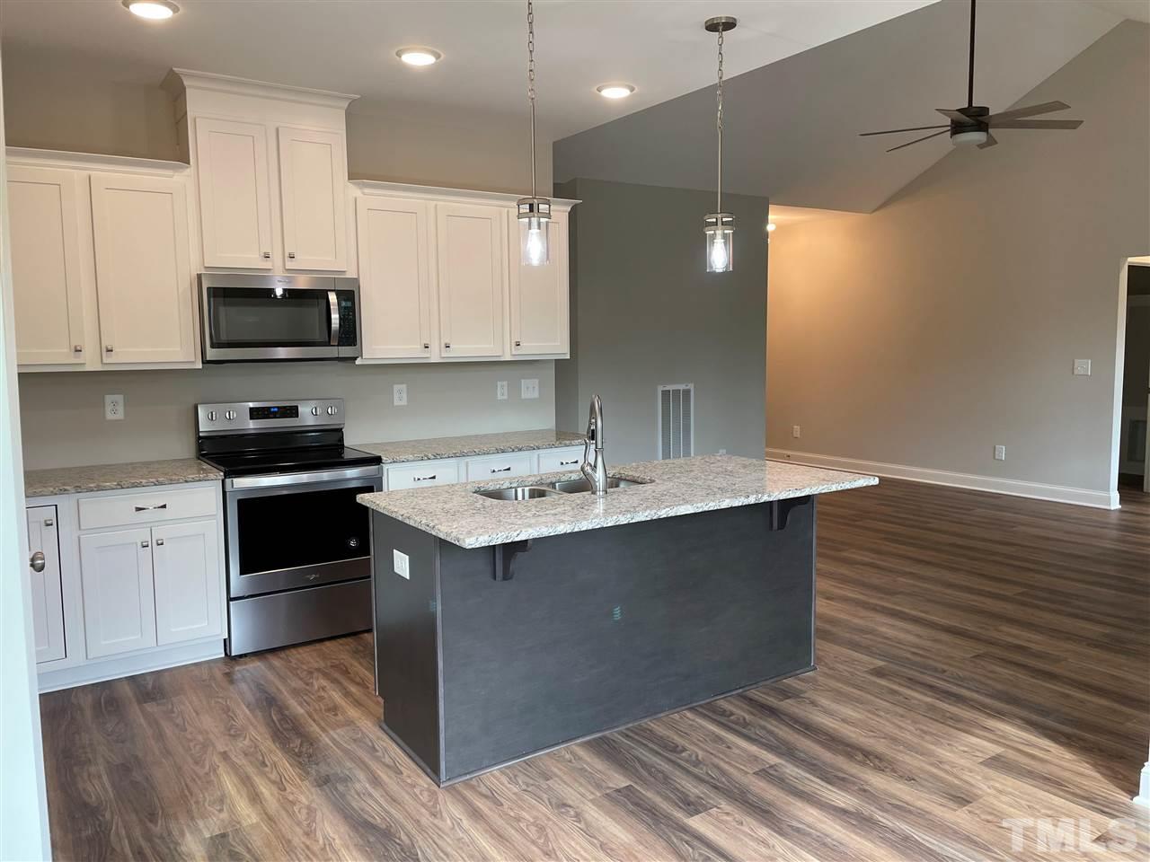 1820 Bryantown Road Spring Hope, NC 27882 - Photo 10 of 23 a kitchen with a sink and cabinets