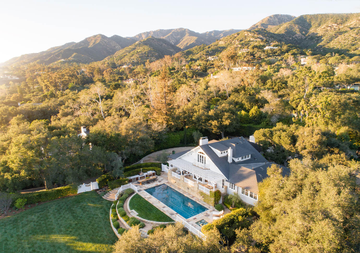 a view of a mountain with a yard