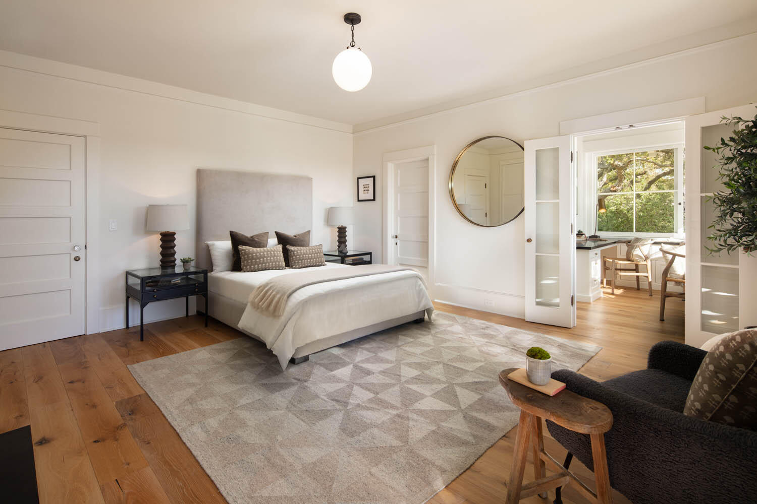 830 Riven Rock Road Montecito, CA 93108 - Photo 15 of 36 a spacious bedroom with a bed a table and a large window