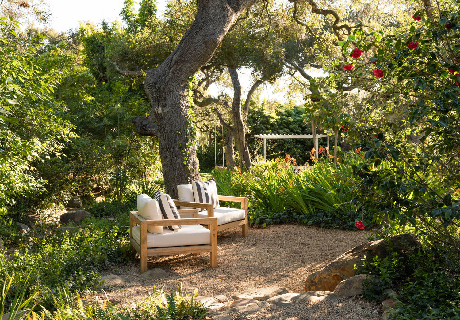 830 Riven Rock Road Montecito, CA 93108 - Photo 27 of 36 a white bench sitting in a backyard of a house