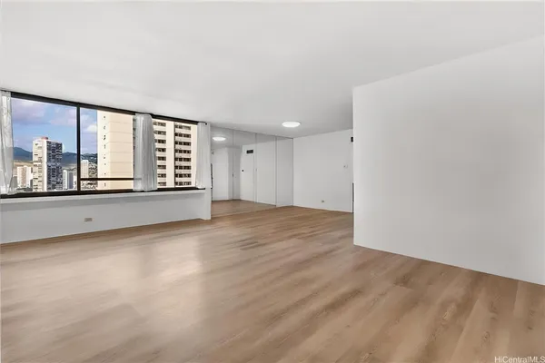 a view of an empty room with a window