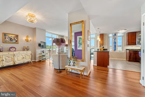 a view of a livingroom with furniture and a flat screen tv