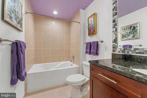 a bathroom with a toilet sink and bathtub