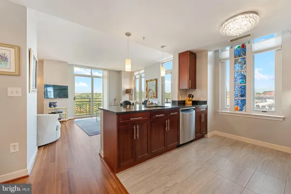 a large room with a large window and wooden floor