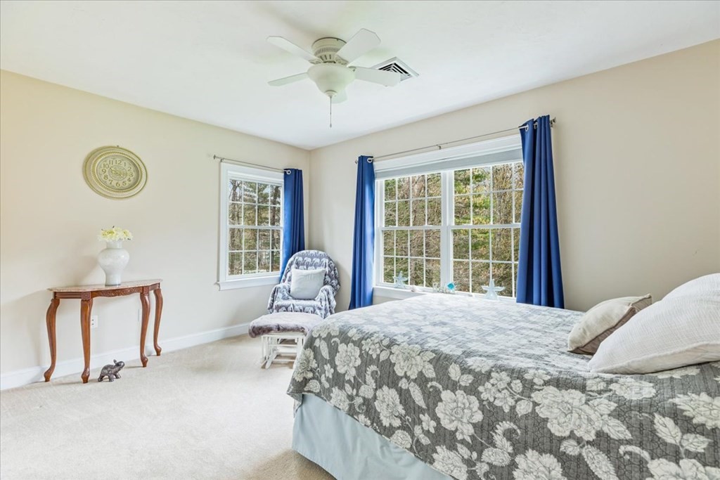 176 Marion Road Middleboro, MA 02346 - Photo 16 of 41 a bedroom with a large bed and a window