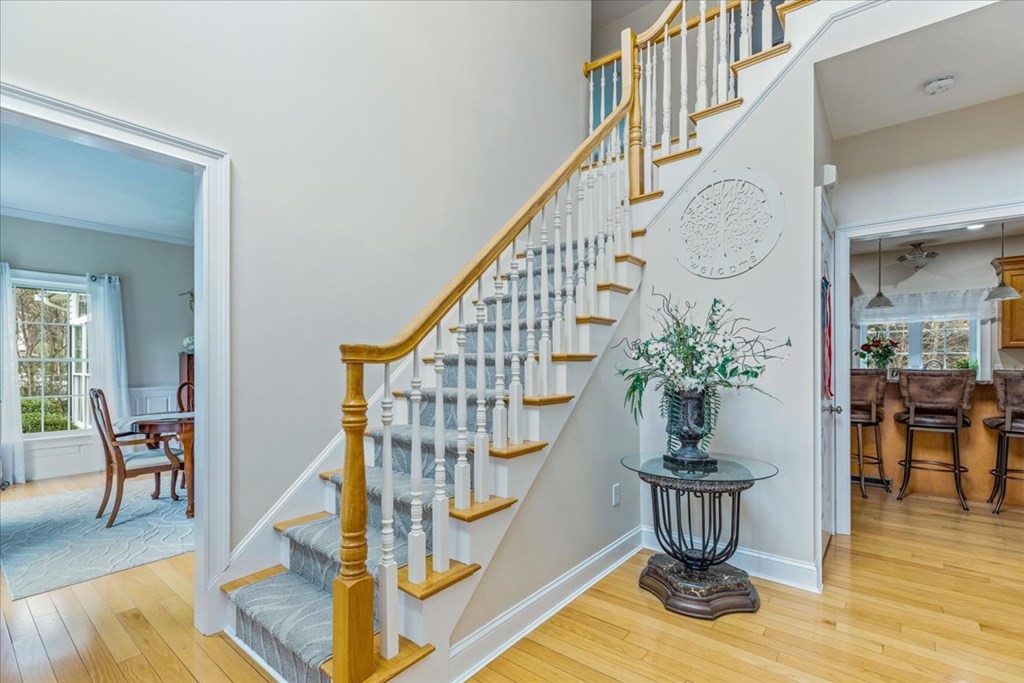 176 Marion Road Middleboro, MA 02346 - Photo 2 of 41 a view of entryway dining room and hall with wooden floor