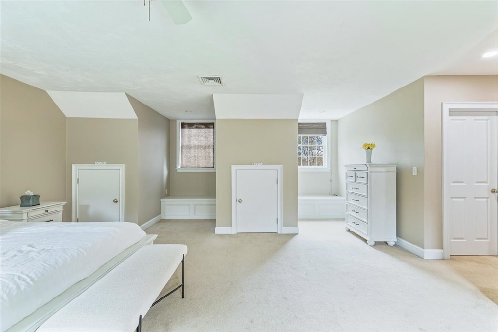176 Marion Road Middleboro, MA 02346 - Photo 22 of 41 a bedroom with a white bed and cabinets