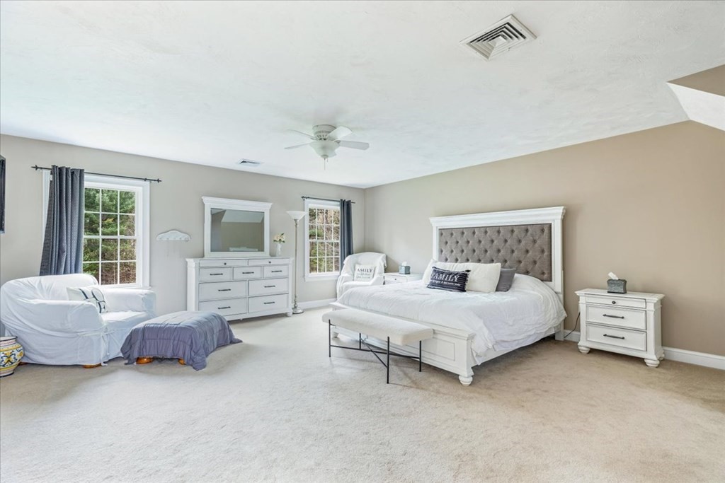 176 Marion Road Middleboro, MA 02346 - Photo 23 of 41 a bedroom with a bed and a couch