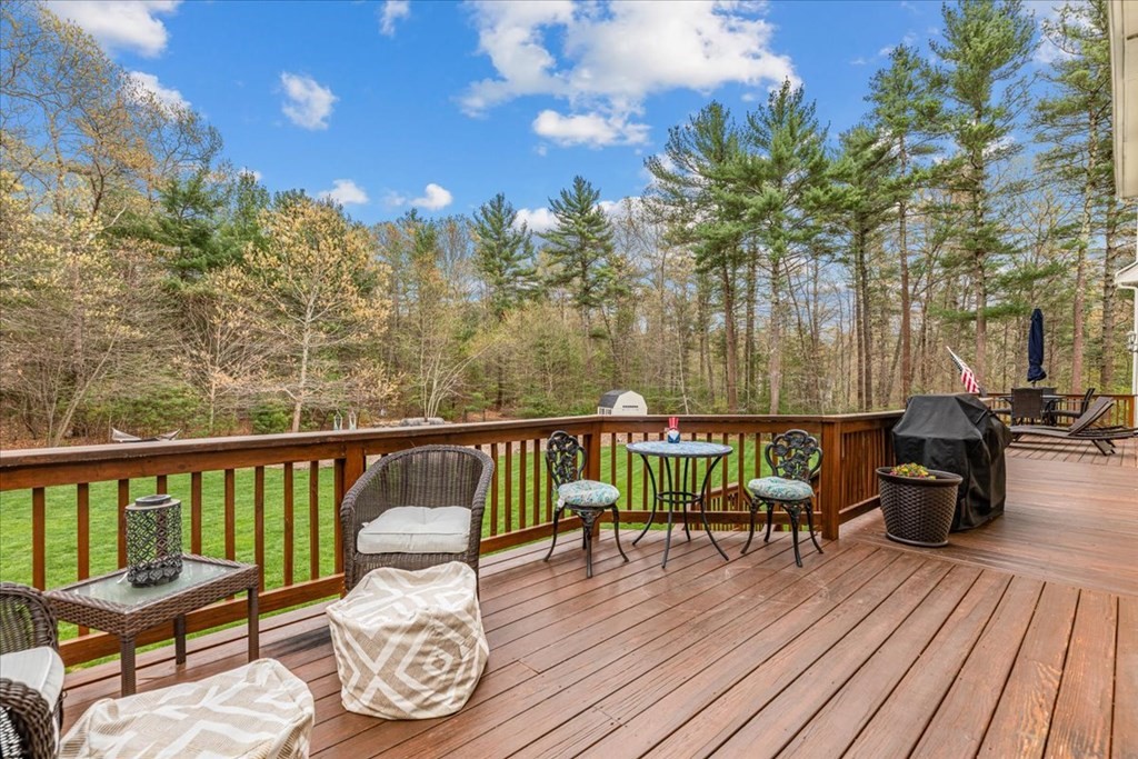176 Marion Road Middleboro, MA 02346 - Photo 29 of 41 a view of a balcony with chairs and wooden floor