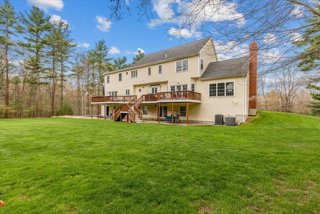 176 Marion Road Middleboro, MA 02346 - Photo 33 of 41 a view of a house with a big yard potted plants and large tree
