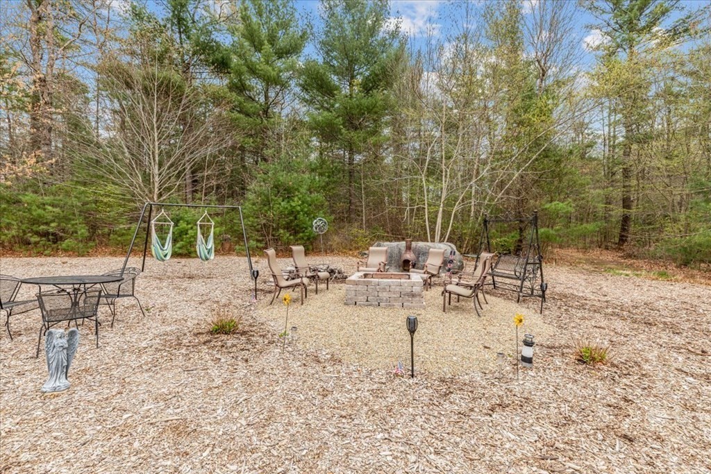 176 Marion Road Middleboro, MA 02346 - Photo 39 of 41 a view of backyard with furniture and plants