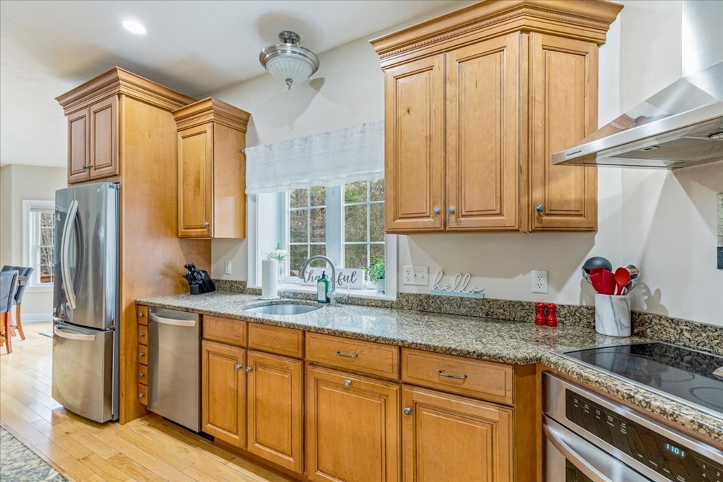 176 Marion Road Middleboro, MA 02346 - Photo 6 of 41 a kitchen with stainless steel appliances granite countertop a sink stove and refrigerator