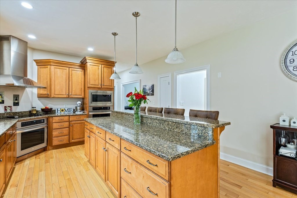 176 Marion Road Middleboro, MA 02346 - Photo 7 of 41 a kitchen with stainless steel appliances granite countertop a sink a stove and a wooden floors