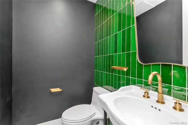 a bathroom with a sink toilet and garden